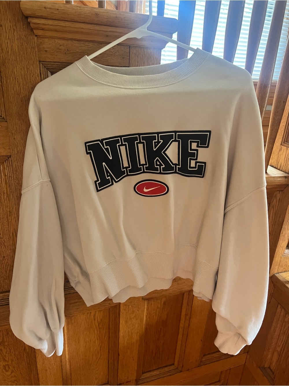 Nike Light Gray Cropped Sweatshirt with Black Logo and Red Accent